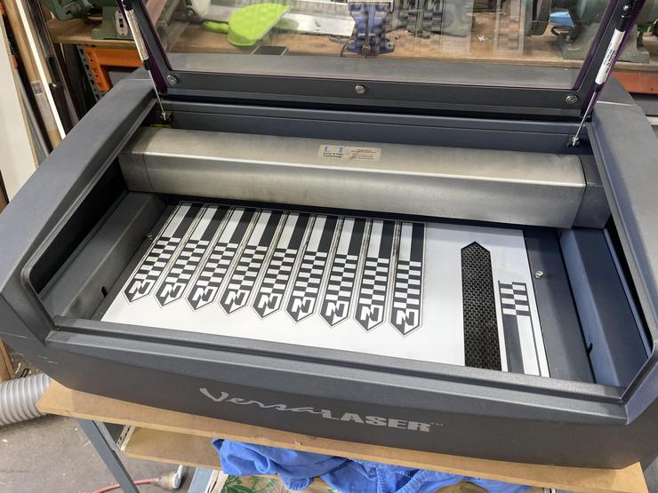 Laser cutting of photographic scales
